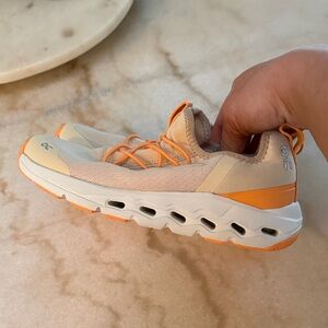 On Running Tan and Orange Athletic Shoes